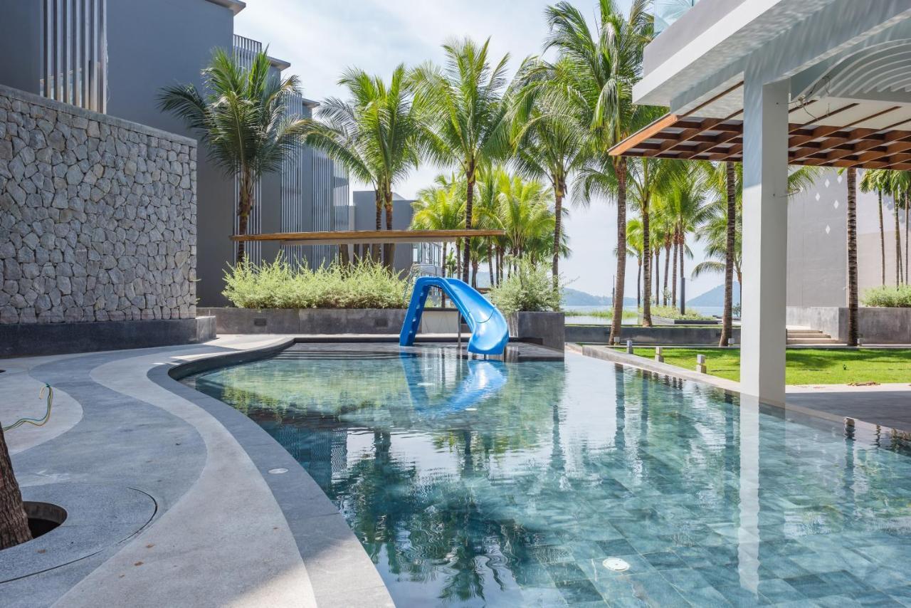 Oceanfront Beach Resort - Sha Extra Plus Patong Екстериор снимка The swimming pool at the resort